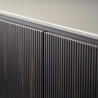 Close-up of a modern radiator against a neutral wall.