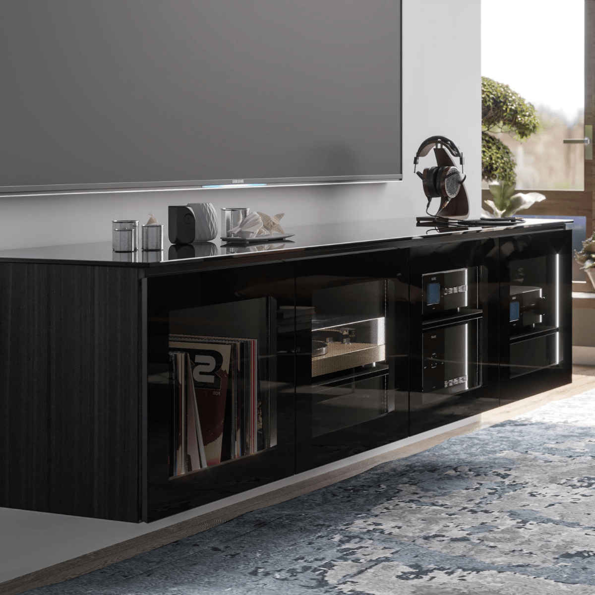 Black entertainment console with electronic devices in a living room setting