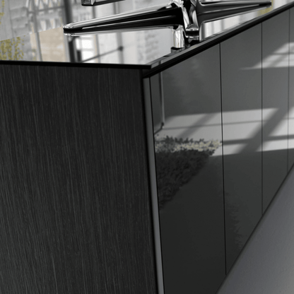 Modern kitchen cabinet with a metallic handle in a minimalistic setting