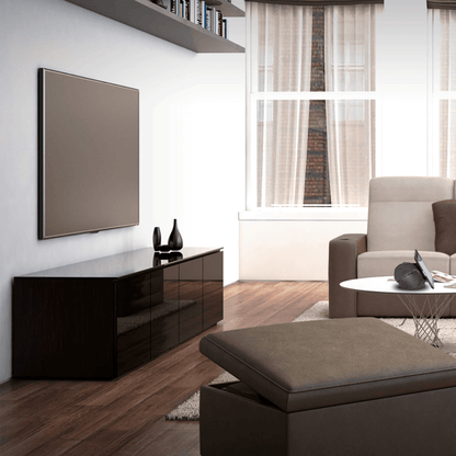 Modern living room with a television, cabinet, and sofa.