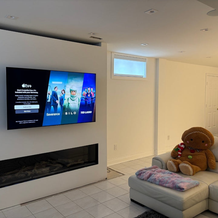 tv mounted on wall in a basement