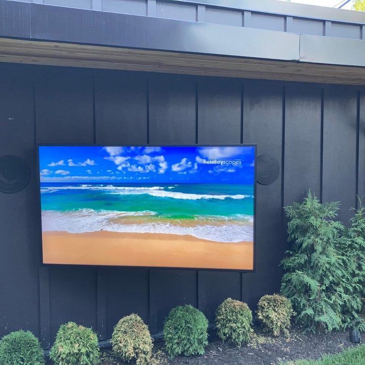 tv mounted on a wall outdoor